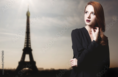 Young redehad girl in dark style with Eiffel tower © Masson