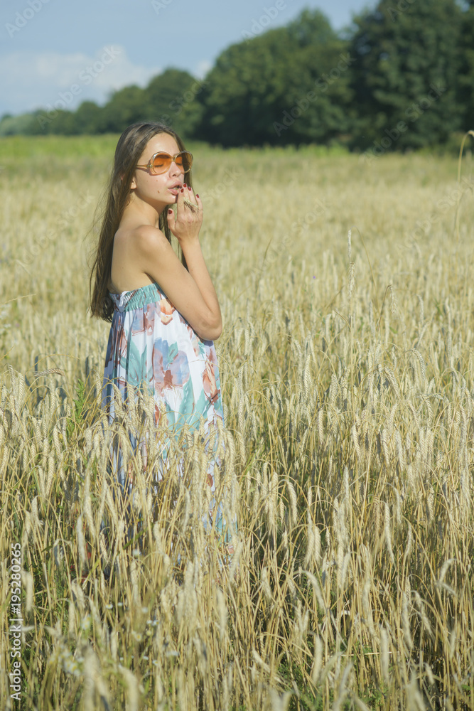Young woman in wheat field, agriculture Young woman in wheat field, agriculture