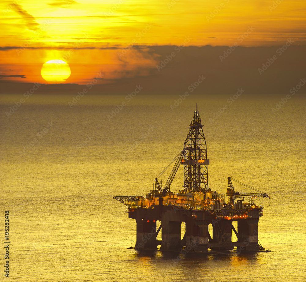 drilling platform on the sea at sunrise