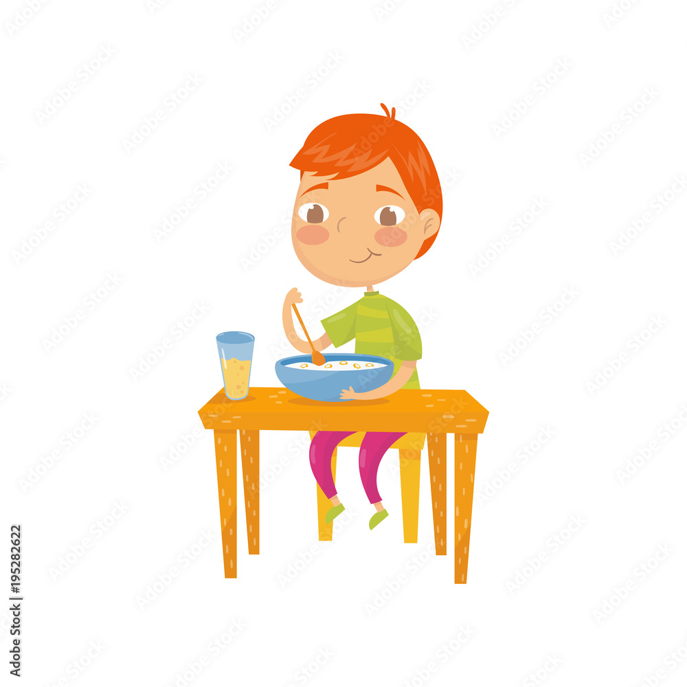Cute red-haired boy sitting at table and eating his breakfast. Bowl of corn flakes rings with milk and glass of orange juice. Cartoon kid character. Flat vector design Cute red-haired boy sitting at table and eating his breakfast. Bowl of corn flakes rings with milk and glass of orange juice. Cartoon kid character. Flat vector design