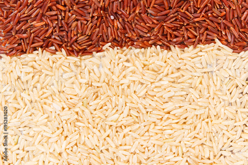Heap of brown and red rice as background, healthy, gluten free nutrition concept Heap of brown and red rice as background, healthy, gluten free nutrition concept