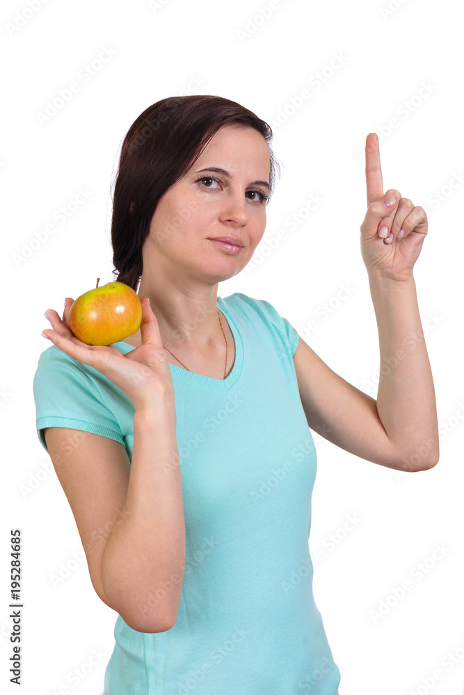 One girl holds with hand fingers apple