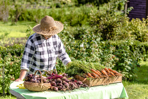 Fresh organic vegetables on farmer market, woman selling produce, local farming concept