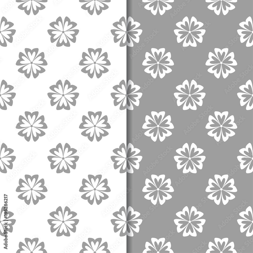 White and gray floral ornaments. Set of seamless backgrounds White and gray floral ornaments. Set of seamless backgrounds