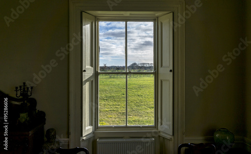 Konstfotografi Look out of an old window inside a vintage house