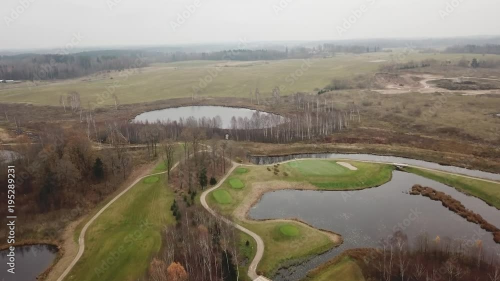 autumn golf field on lake shore Lithuania Aerial drone top view 4K UHD video autumn golf field on lake shore Lithuania Aerial drone top view 4K UHD video