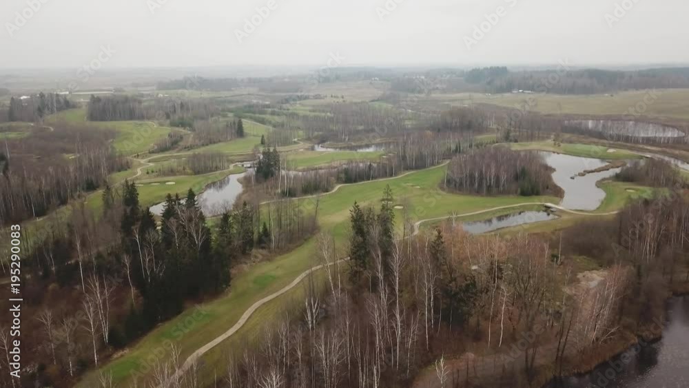 autumn golf field on lake shore Lithuania Aerial drone top view 4K UHD video autumn golf field on lake shore Lithuania Aerial drone top view 4K UHD video
