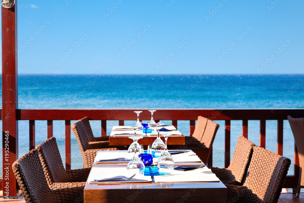 The open air restaurant by the sea is ready to receive visitors.