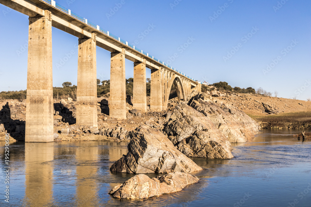 The Ricobayo reservoir (Embalse de Ricobayo) and the Puente de la Estrella arch bridge over the Esla river in Zamora, Castile and Leon, Spain. Almost dried during winter 2018