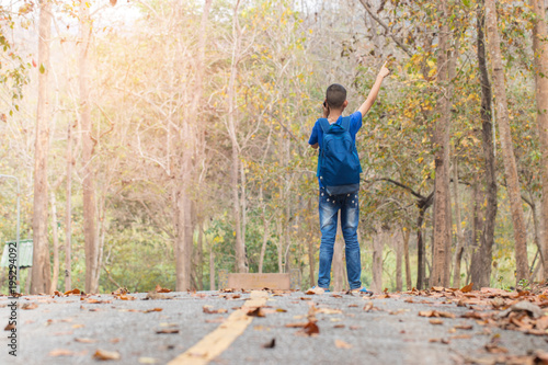 Boys use smartphones to communicate. He's lost his way and is looking for a way out of here. Waiting for help hopefully. Problems caused by tourism concept. Soft focus.