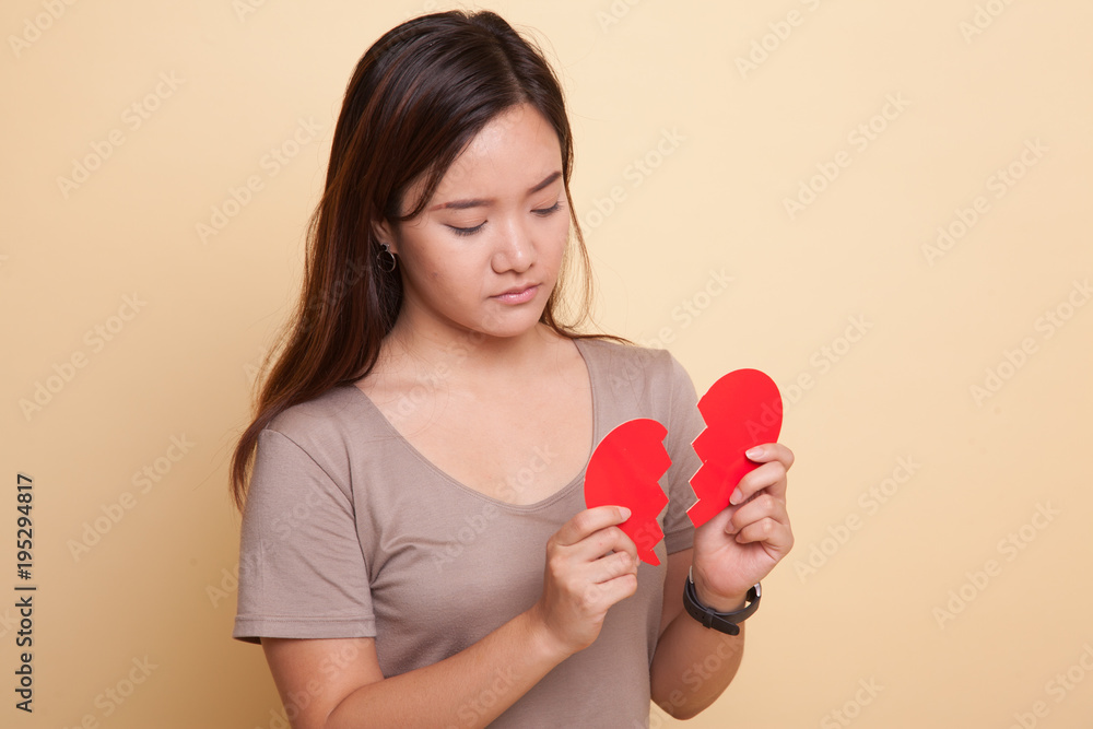 Beautiful young Asian woman with broken heart. Beautiful young Asian woman with broken heart.
