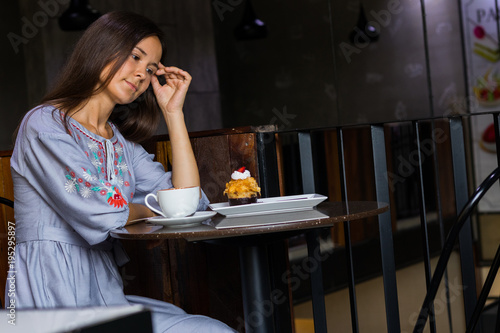 Woman waiting meeting with friends in cafe