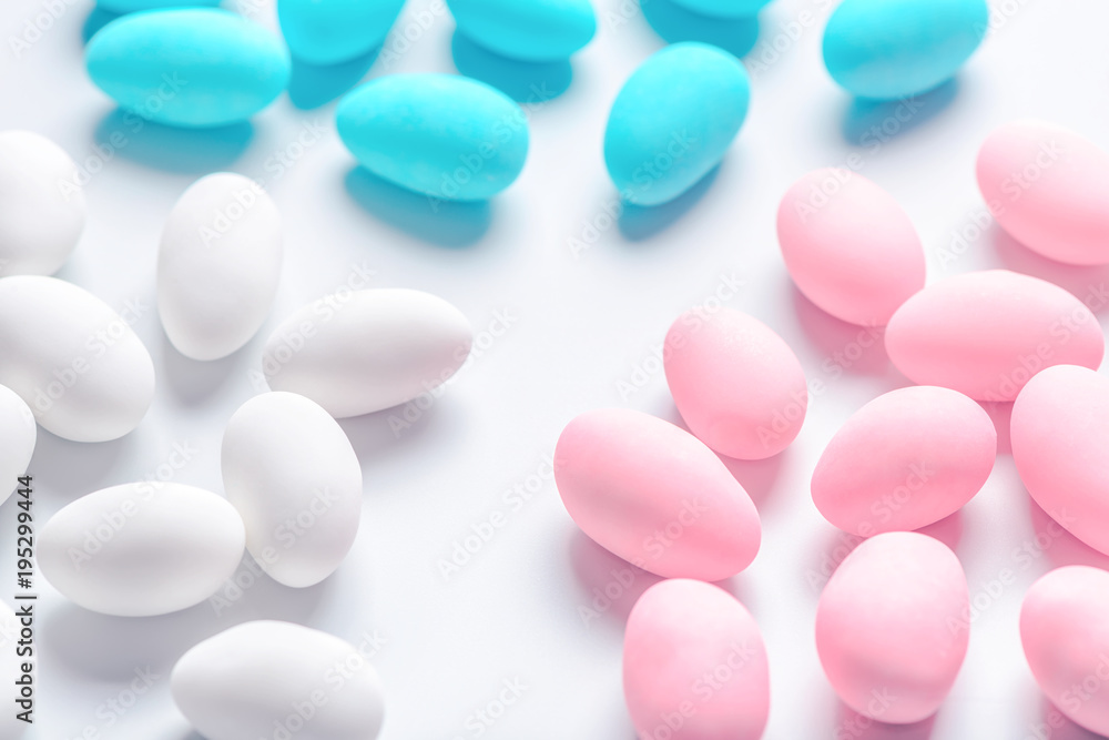 blue, pink and white sugared almond candies like festive background