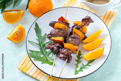 Shish kebabs from chicken liver with tangerines