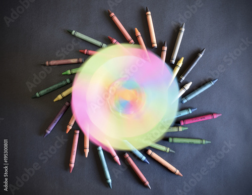 Colorful whirl or swirl shape formed by coloring waxes. Movement aesthetic effect. Colorful graphic design resources and backgrounds. Wheel circle of colors. photo