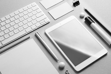 Set of devices and stationery on grey background. Mockup for design