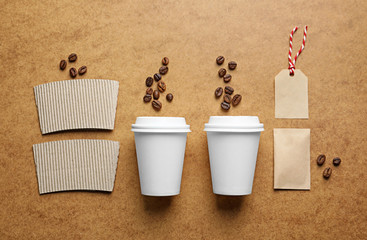 Composition with blank cups as mockups for branding on color background