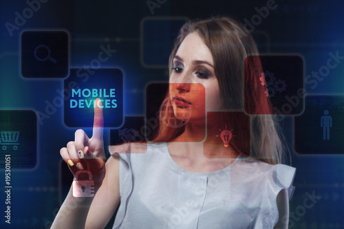 The concept of business, technology, the Internet and the network. A young entrepreneur working on a virtual screen of the future and sees the inscription: Mobile devices