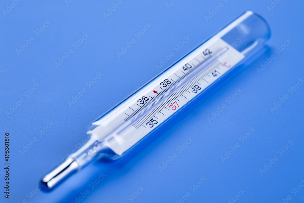 Obraz premium medical thermometer on a blue