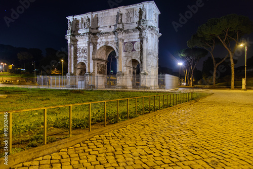 Monuments of ancient Rome at night. Colosseum, Arch of Constantine and Roman Forum