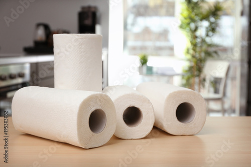Rolls of paper towels on ta...