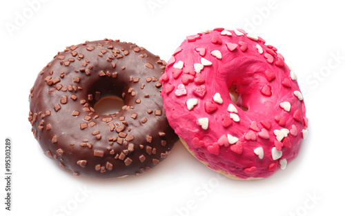 Delicious colorful donuts on white background