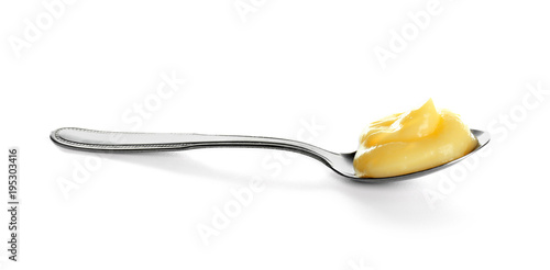 Fotografie, Tablou Tasty vanilla pudding in spoon on white background