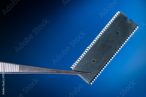 Electronic chip isolated on dark blue