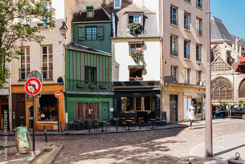 Typical view of the Parisian street with tables of cafe in Paris, France.