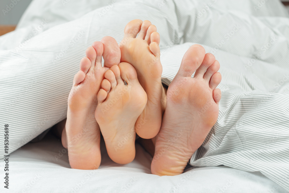 beautiful couple lying together on the bed beautiful couple lying together on the bed