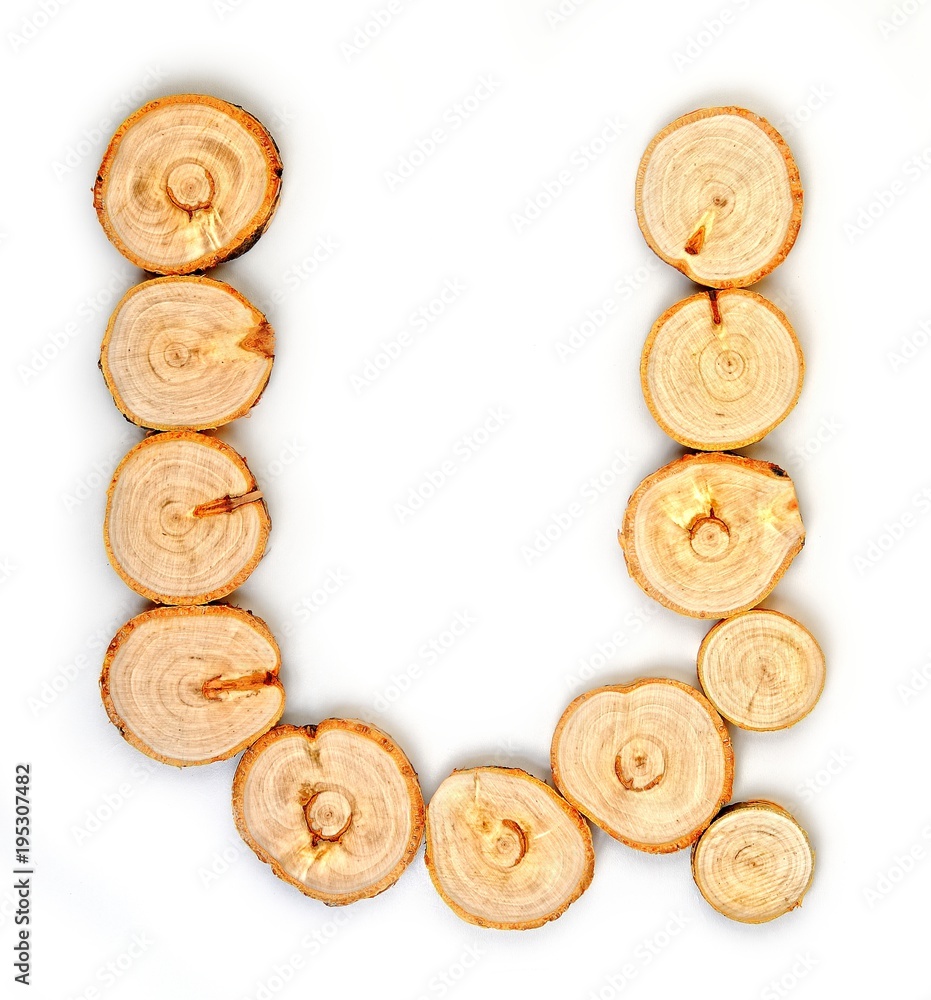 Alphabet letters made from Wood slice on white Background.u Alphabet letters made from Wood slice on white Background.u