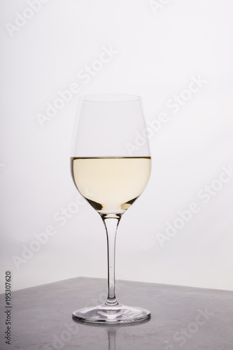 Glass of white wine on a bar counter