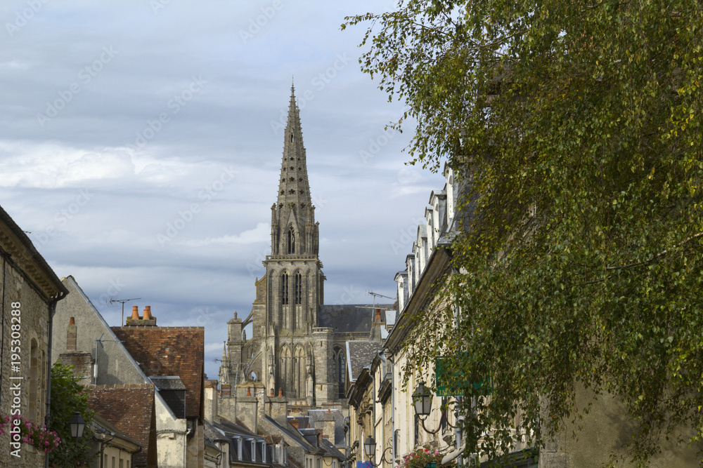 The cathedral at Sees towers over a shopping street, Orne, Normandy, France