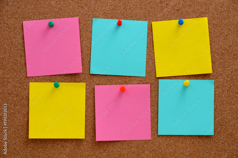Blank notes pinned into brown corkboard Blank notes pinned into brown corkboard