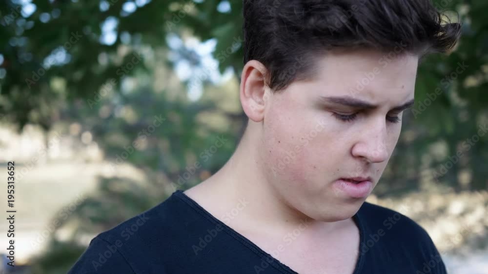 Sad, pensive depressed young man alone in the park Sad, pensive depressed young man alone in the park