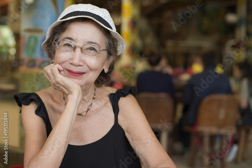 Senior Woman In The Restaurant