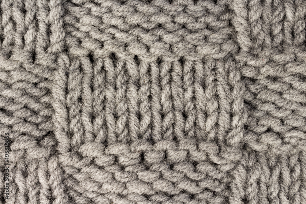 Knitting. Gray knit fabric texture background or knitted pattern background Knitting. Gray knit fabric texture background or knitted pattern background