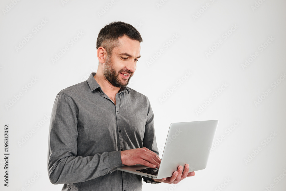 Concentrated businessman using laptop computer. Concentrated businessman using laptop computer.