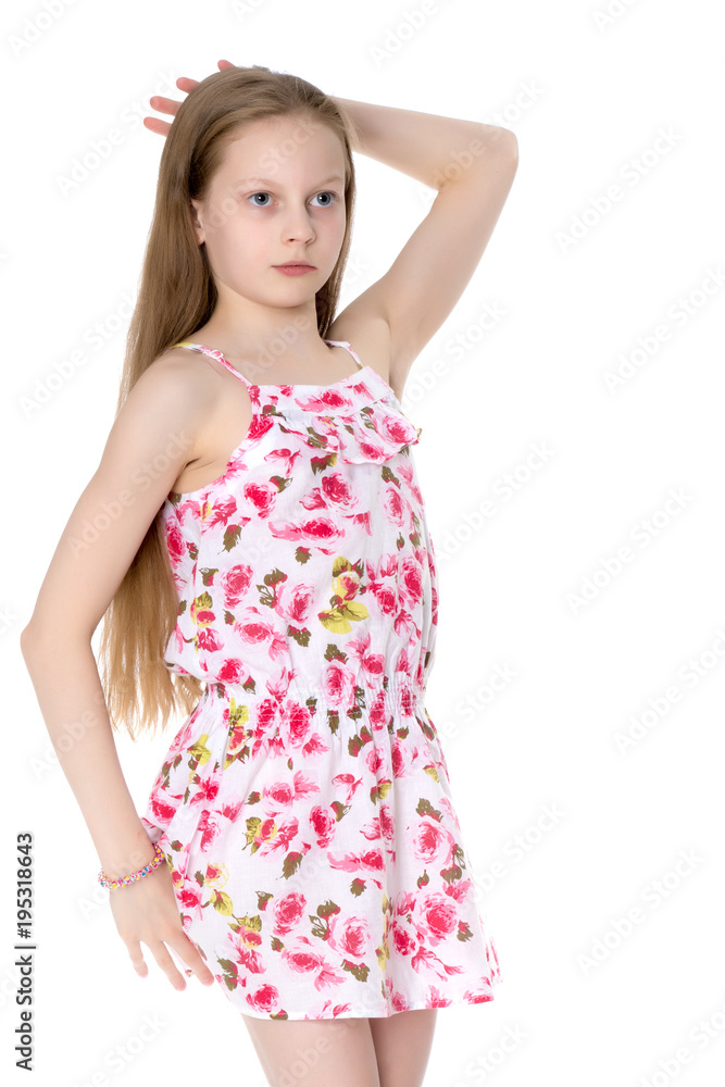 A little girl in a short summer dress.