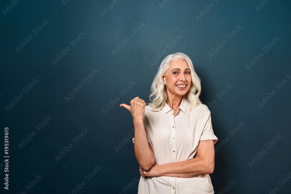 Beautiful mature old woman pointing. Beautiful mature old woman pointing.
