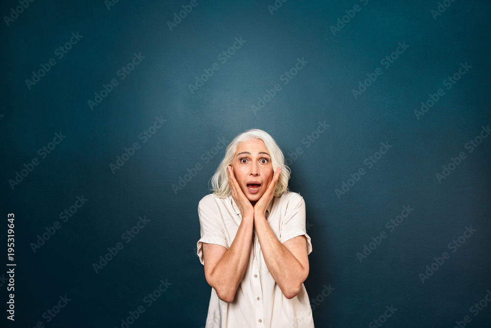 Shocked screaming mature old woman