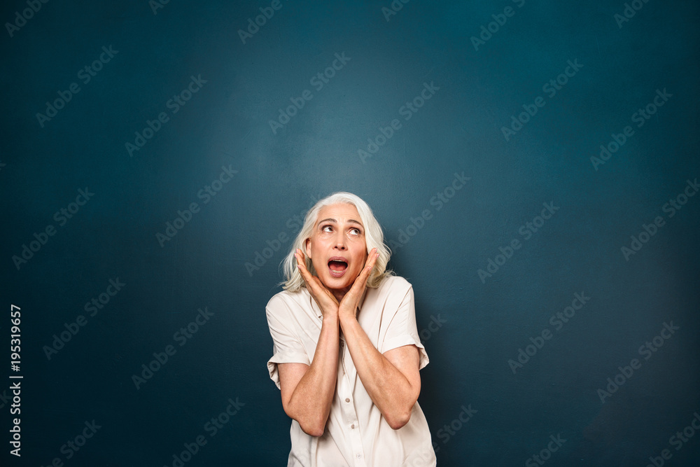 Shocked screaming mature old woman