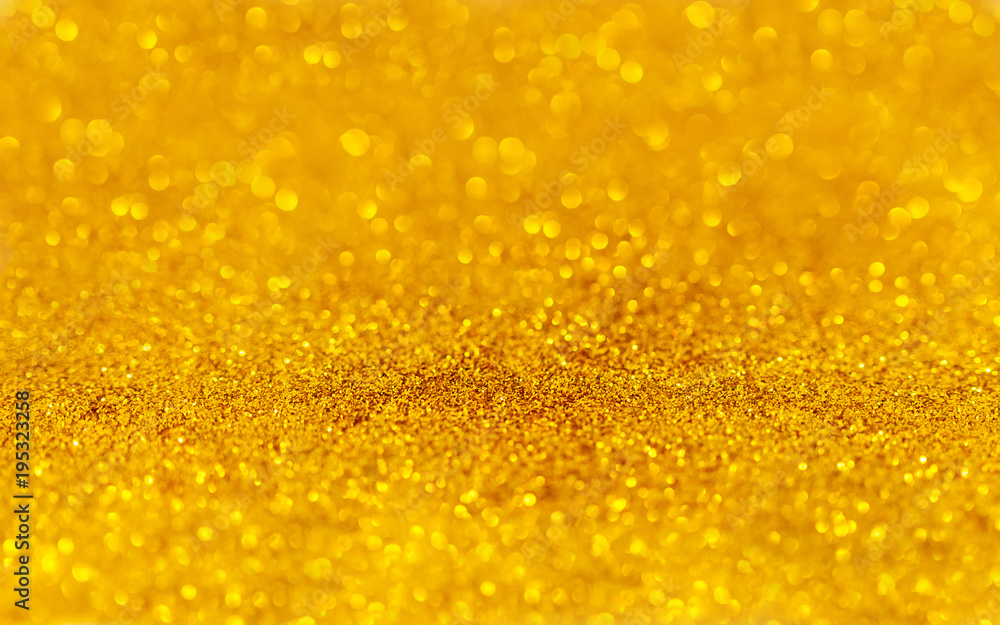 Golden beautiful blurred bokeh background with copy space. Holiday texture. Wallpaper. Glitter light spots on golden background, defocused Golden beautiful blurred bokeh background with copy space. Holiday texture. Wallpaper. Glitter light spots on golden background, defocused