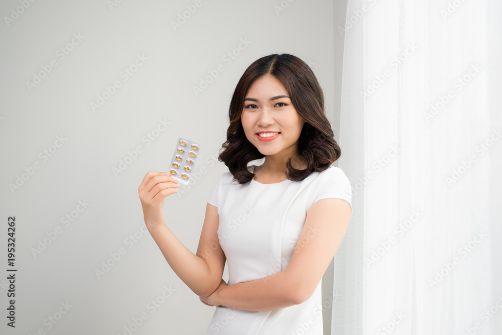 Beauty portrait of a beautiful young woman with pills. Beauty portrait of a beautiful young woman with pills.