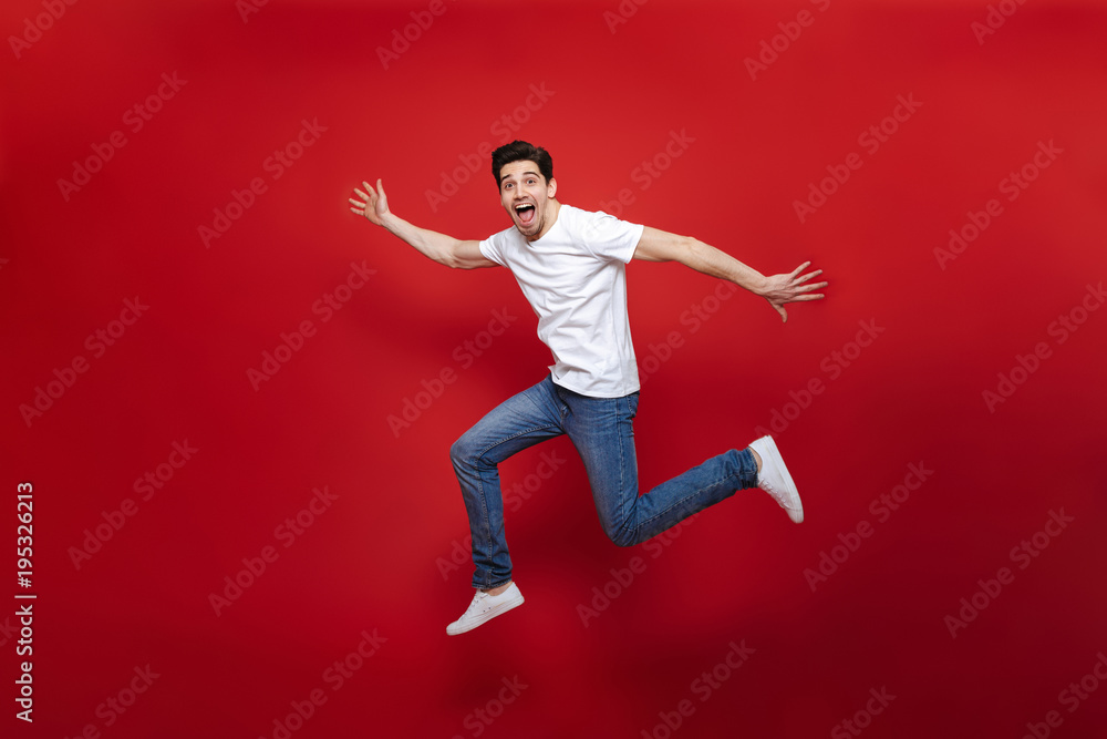 Full length portrait of an excited young man Full length portrait of an excited young man