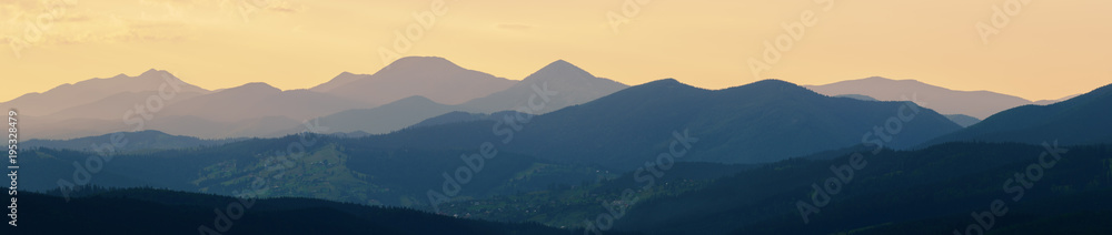 Abstract panoramic mountain landscape, tonal perspective at sunset.