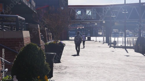 Man Walking Under The Sun Near Bridge - Static