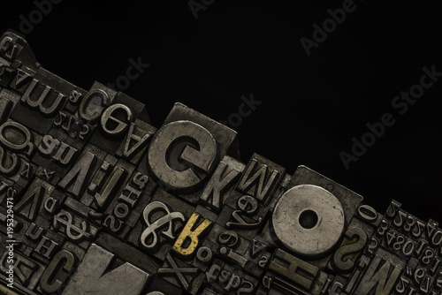 Metal Letterpress Types.
A background from many historical typography letters in black and white with white background.
