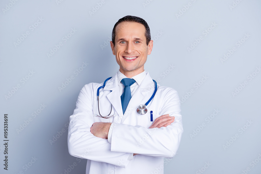 Wellness wellbeing people lifestyle career profession help people person concept. Portrait of glad friendly satisfied handsome doc standing with folded arms isolated on gray background copy-space Wellness wellbeing people lifestyle career profession help people person concept. Portrait of glad friendly satisfied handsome doc standing with folded arms isolated on gray background copy-space