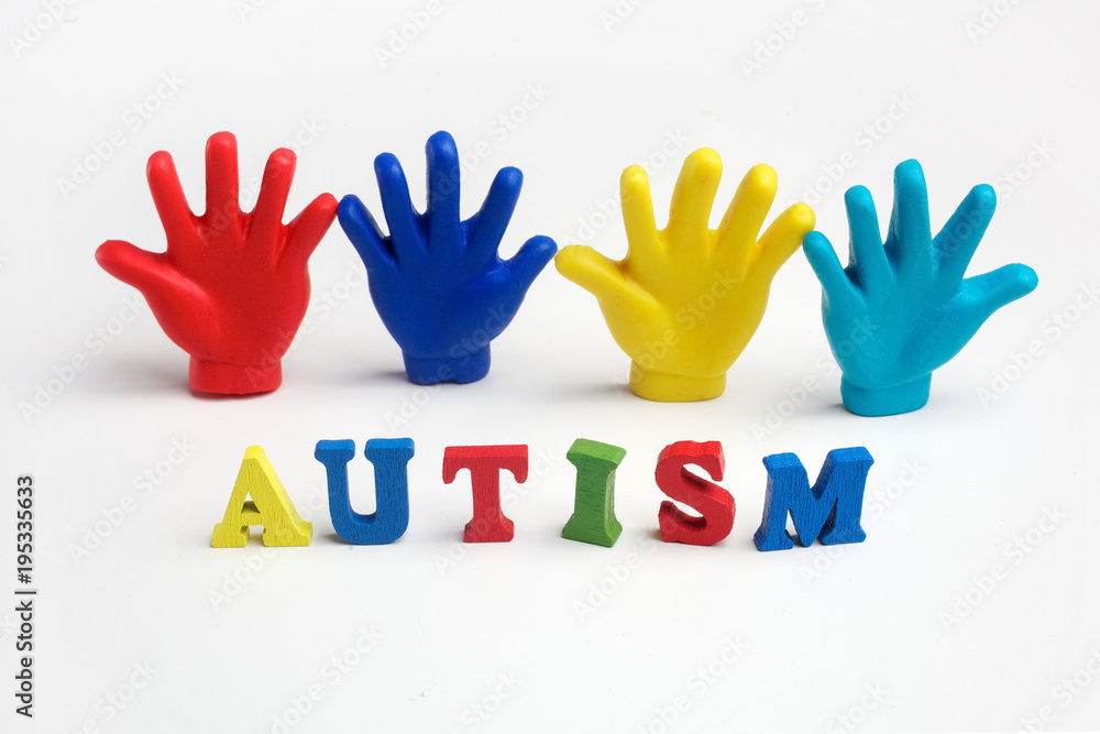 Autism awareness concept with colorful hands on white background. Top view Autism awareness concept with colorful hands on white background. Top view